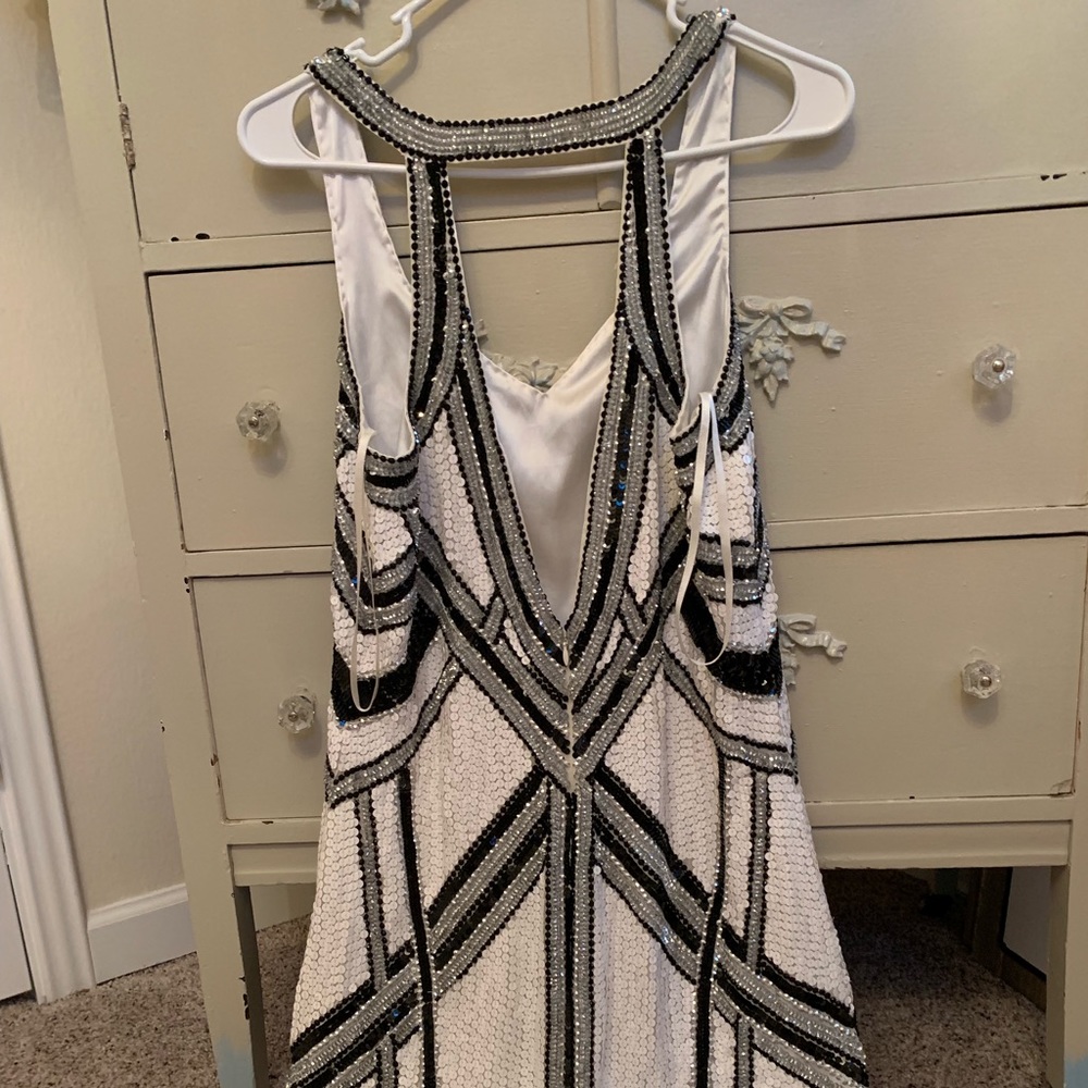 Parker dress new not worn has bag of spare sequin
